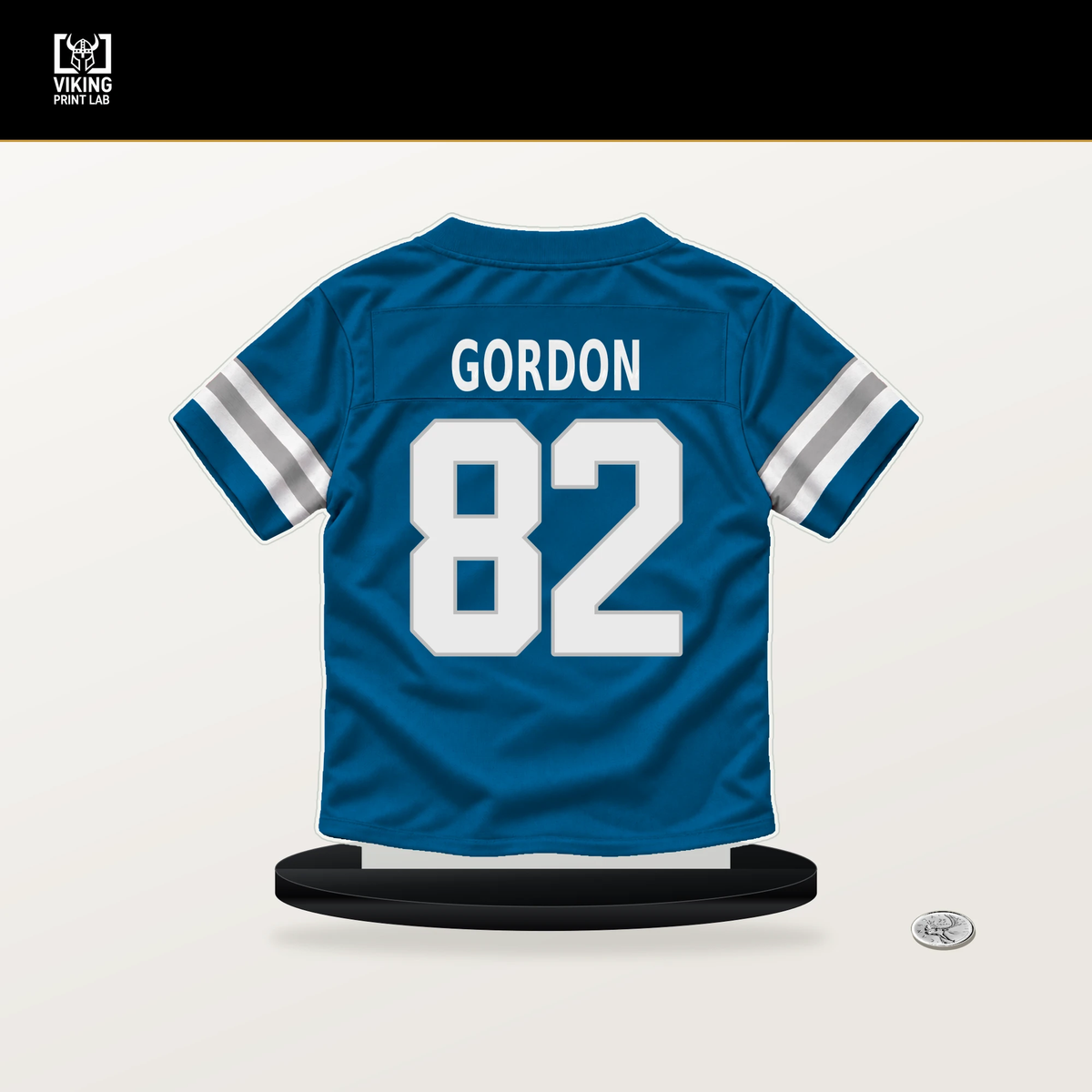 Thomas Gordon number 82 Detroit Lions jersey stand with included black base.
