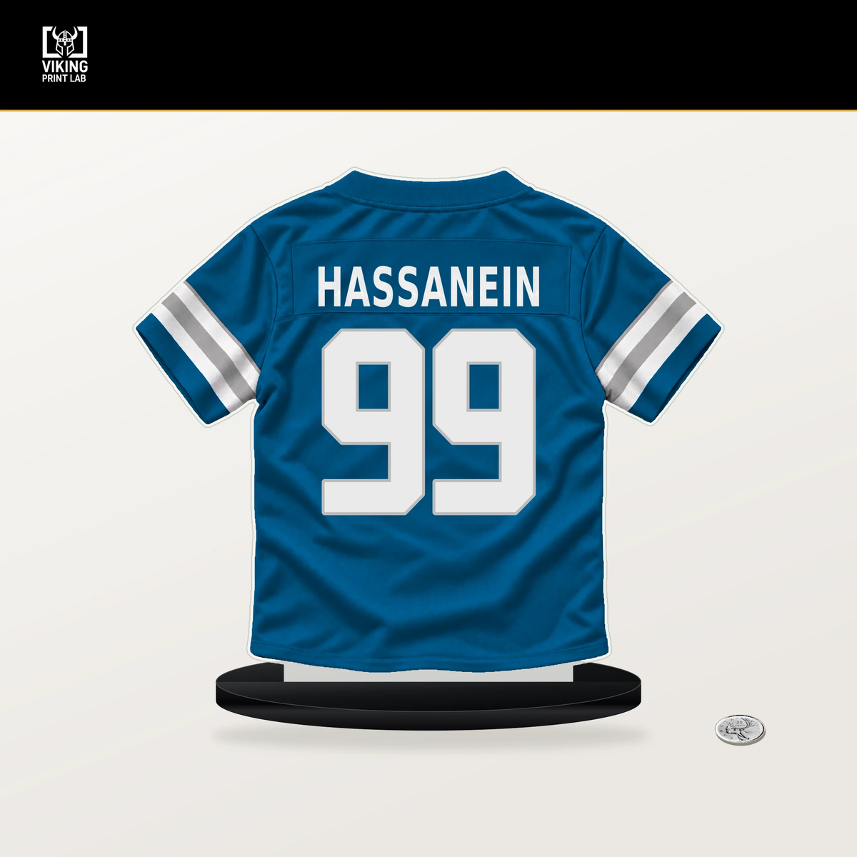Ahmed Hassanein number 99 Detroit Lions jersey stand with included black base.