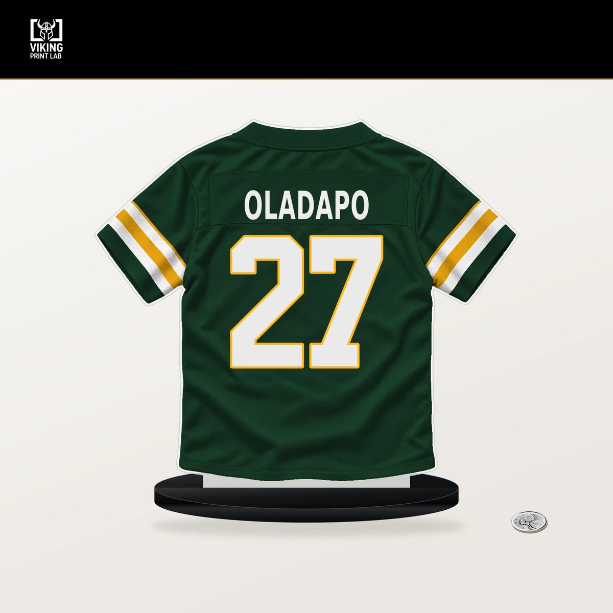 Kitan Oladapo number 27 Green Bay Packers jersey stand with included black base.
