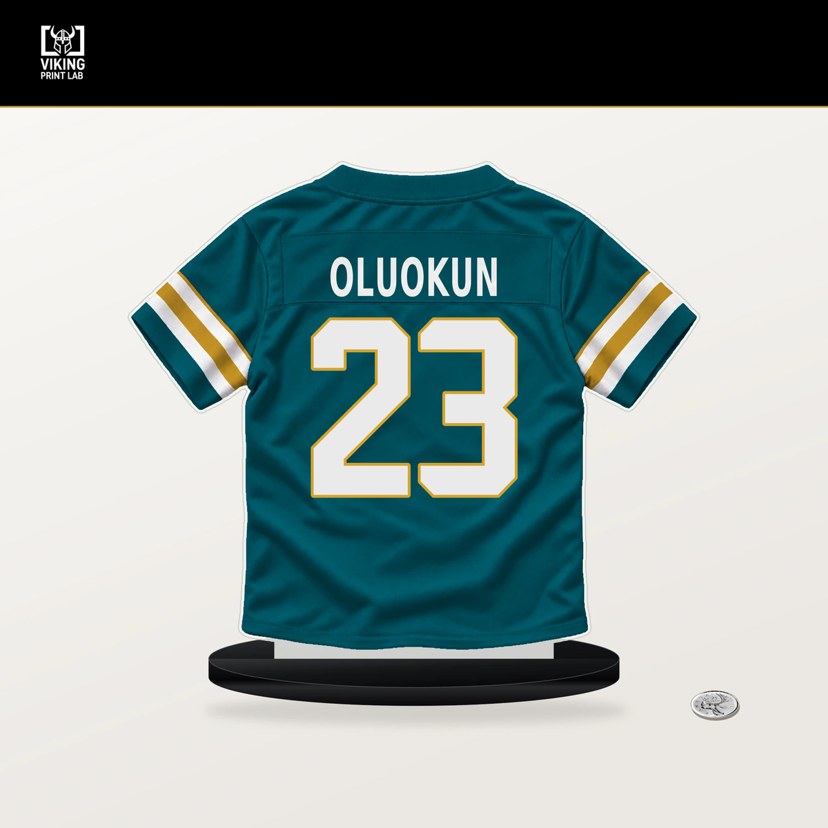 Foyesade Oluokun number 23 Jacksonville Jaguars jersey stand with included black base.