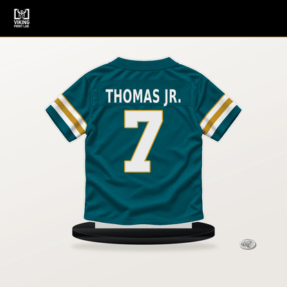 Brian Thomas Jr. number 7 Jacksonville Jaguars jersey stand with included black base.