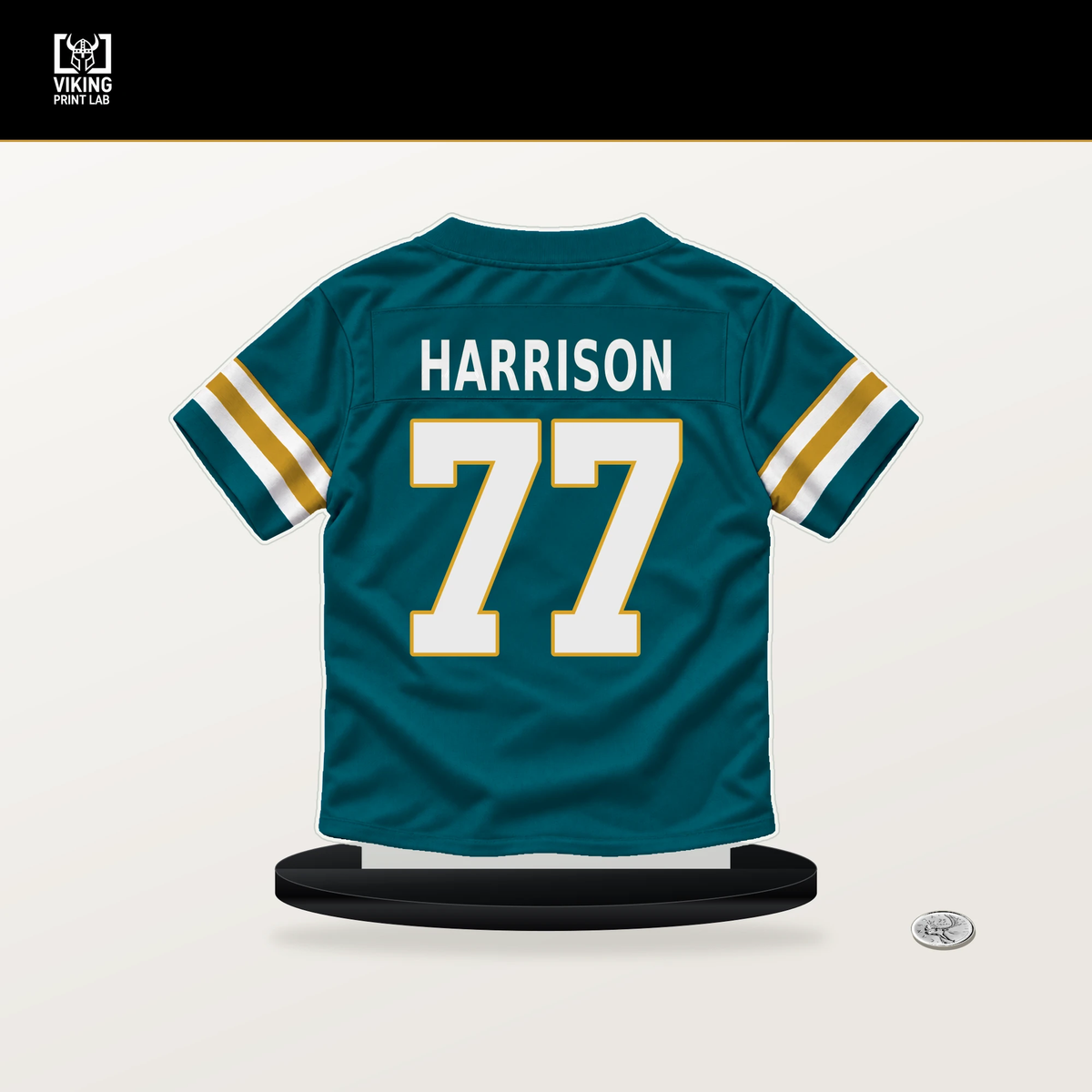Anton Harrison number 77 Jacksonville Jaguars jersey stand with included black base.