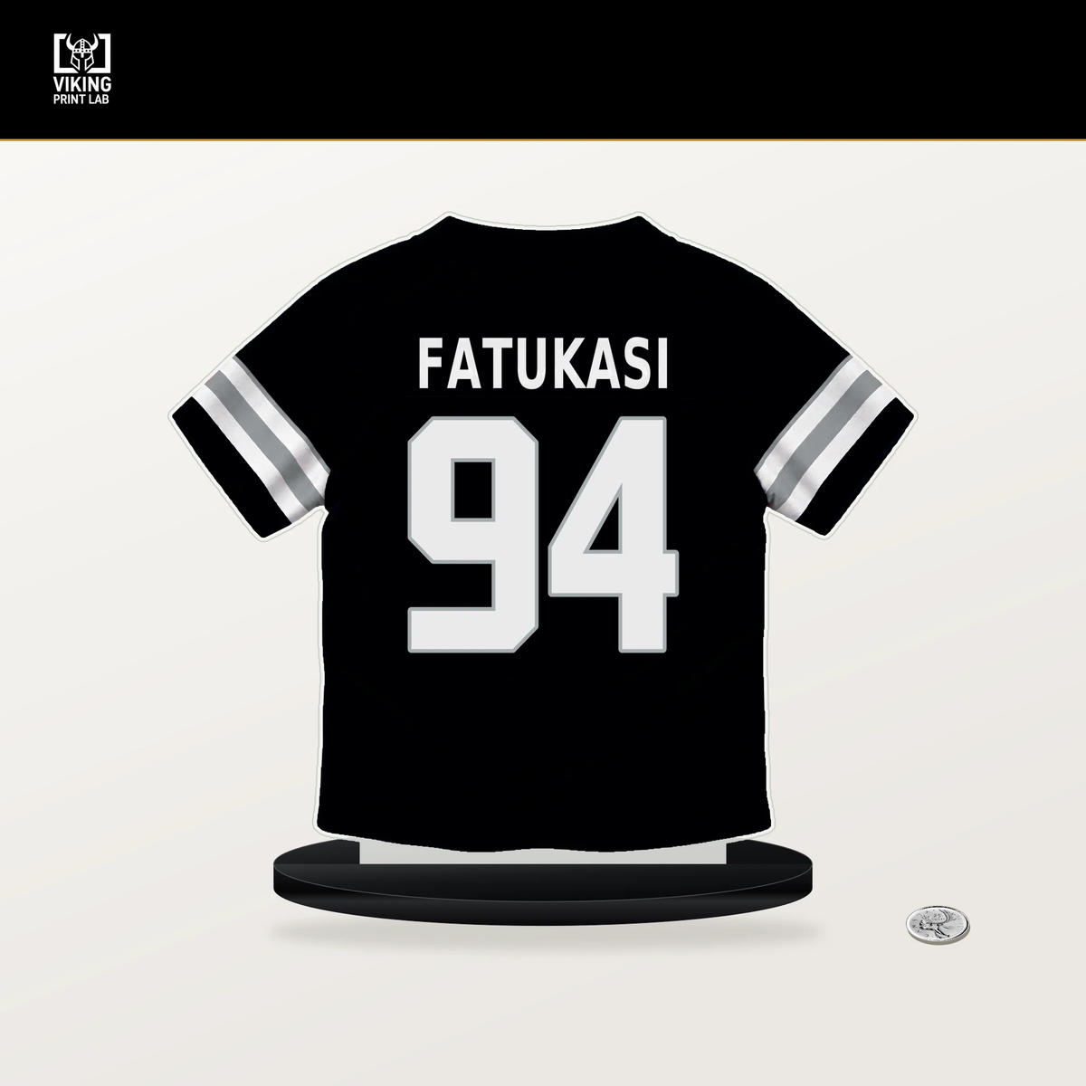 Folorunso Fatukasi number 94 Las Vegas Raiders jersey stand with included black base.