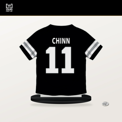 Jeremy Chinn number 11 Las Vegas Raiders jersey stand with included black base.