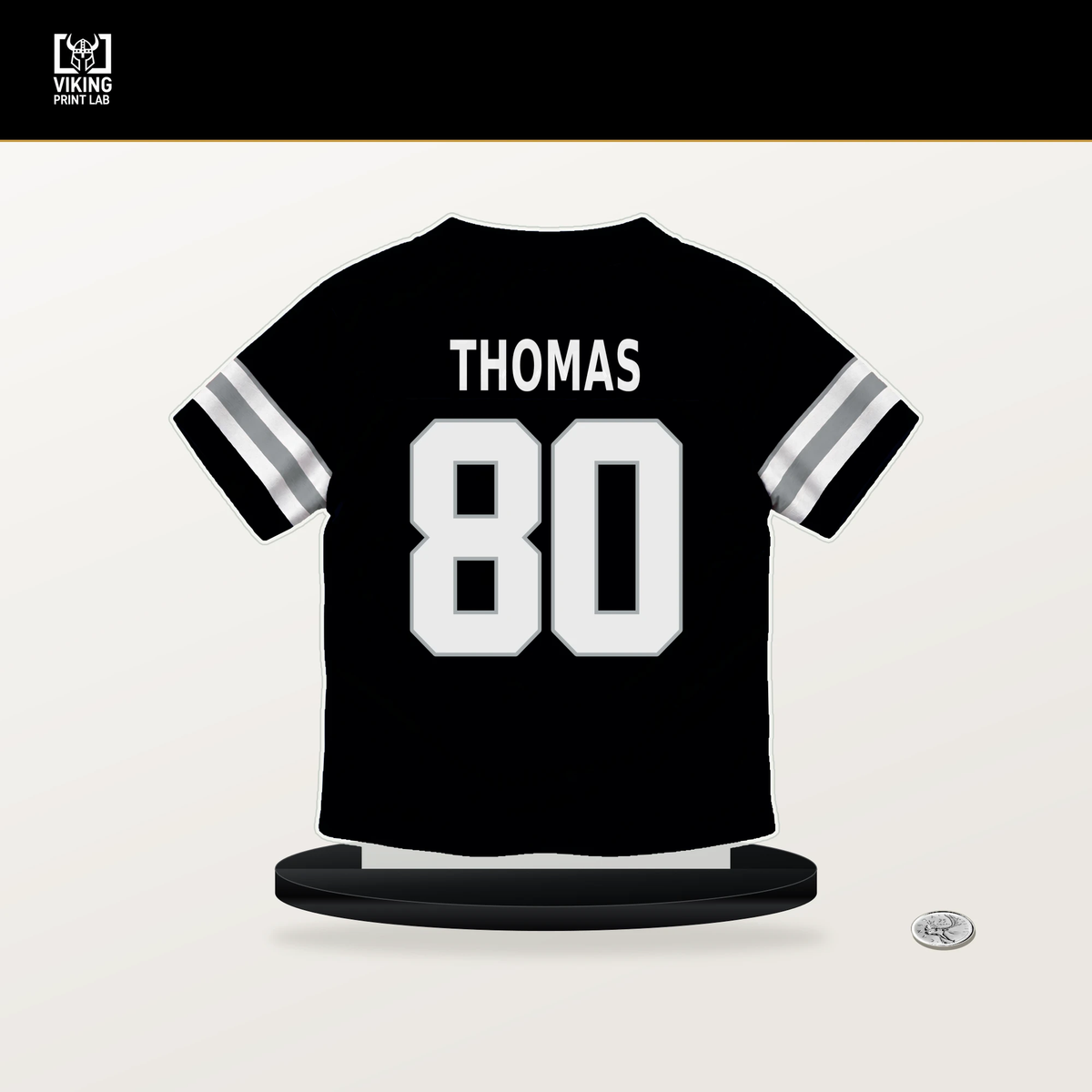 Ian Thomas number 80 Las Vegas Raiders jersey stand with included black base.
