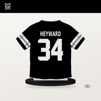 Connor Heyward number 34 Las Vegas Raiders jersey stand with included black base.