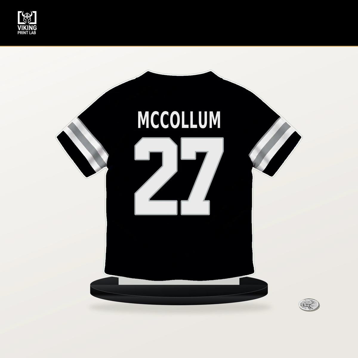 Tristin McCollum number 27 Las Vegas Raiders jersey stand with included black base.