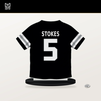 Eric Stokes number 5 Las Vegas Raiders jersey stand with included black base.