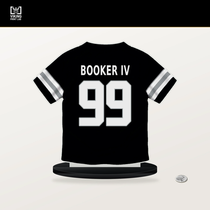 Thomas Booker IV number 99 Las Vegas Raiders jersey stand with included black base.