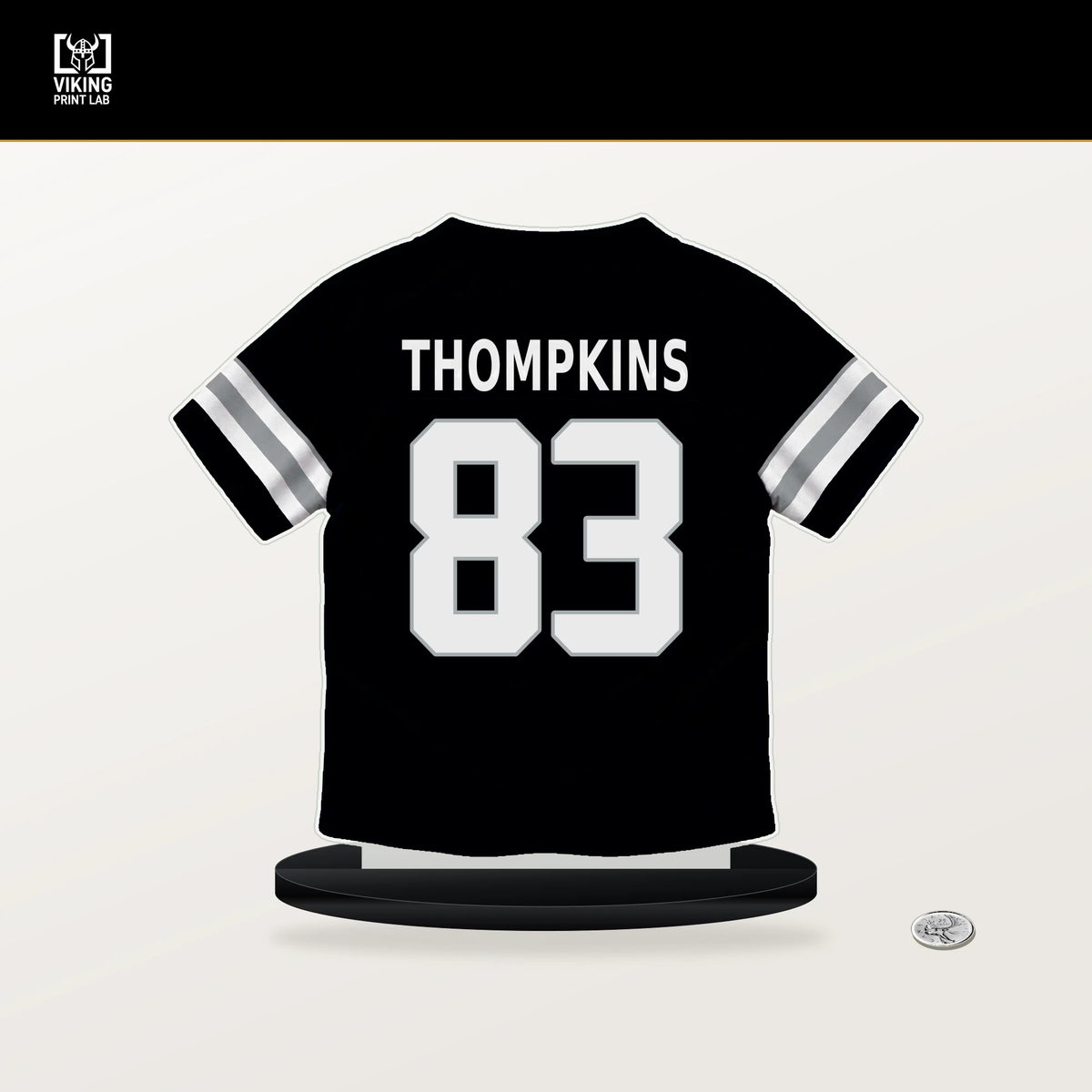 Deven Thompkins number 83 Las Vegas Raiders jersey stand with included black base.
