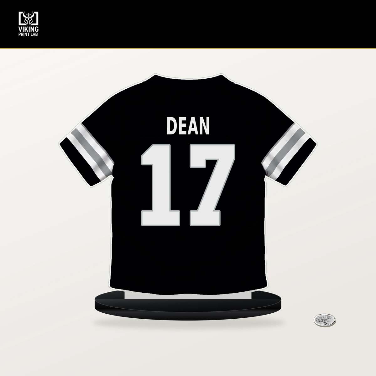 Nakobe Dean number 17 Las Vegas Raiders jersey stand with included black base.