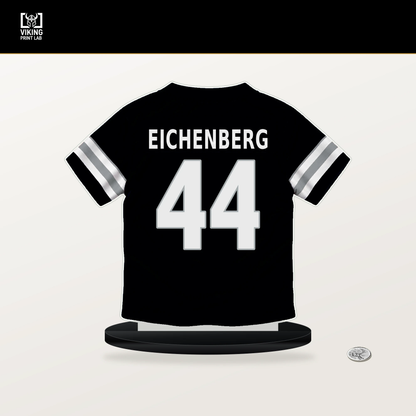 Tommy Eichenberg number 44 Las Vegas Raiders jersey stand with included black base.