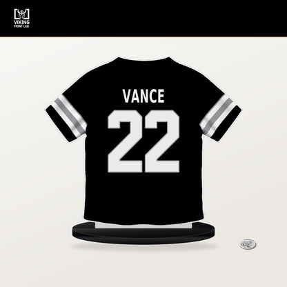 Greedy Vance number 22 Las Vegas Raiders jersey stand with included black base.
