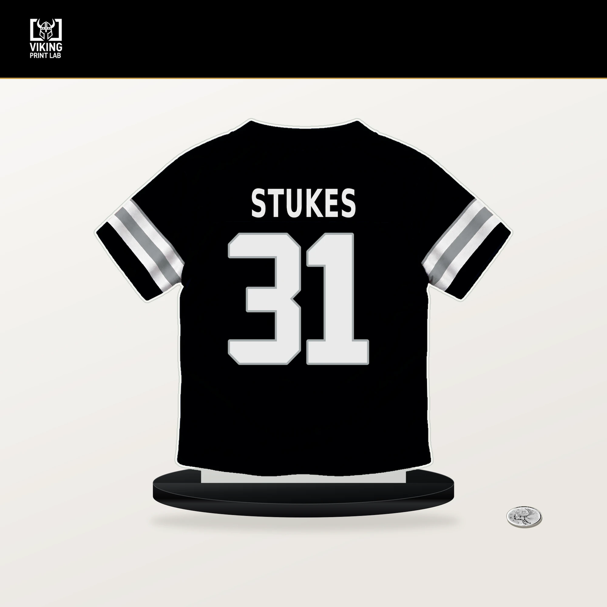 Treydan Stukes number 31 Las Vegas Raiders jersey stand with included black base.