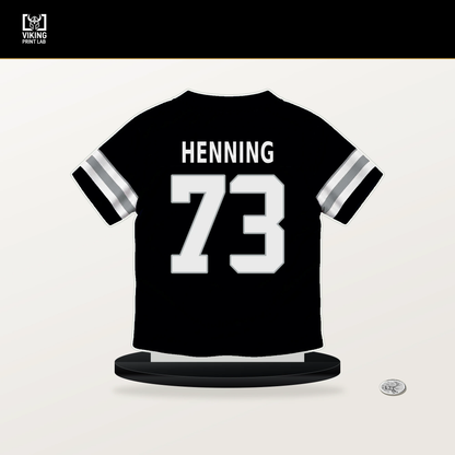Niklas Henning number 73 Las Vegas Raiders jersey stand with included black base.