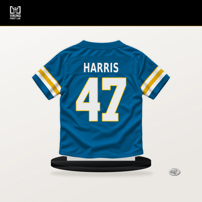 Josh Harris number 47 Los Angeles Chargers jersey stand with included black base.