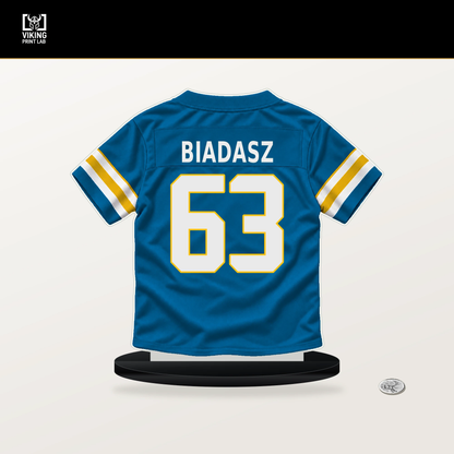 Tyler Biadasz number 63 Los Angeles Chargers jersey stand with included black base.