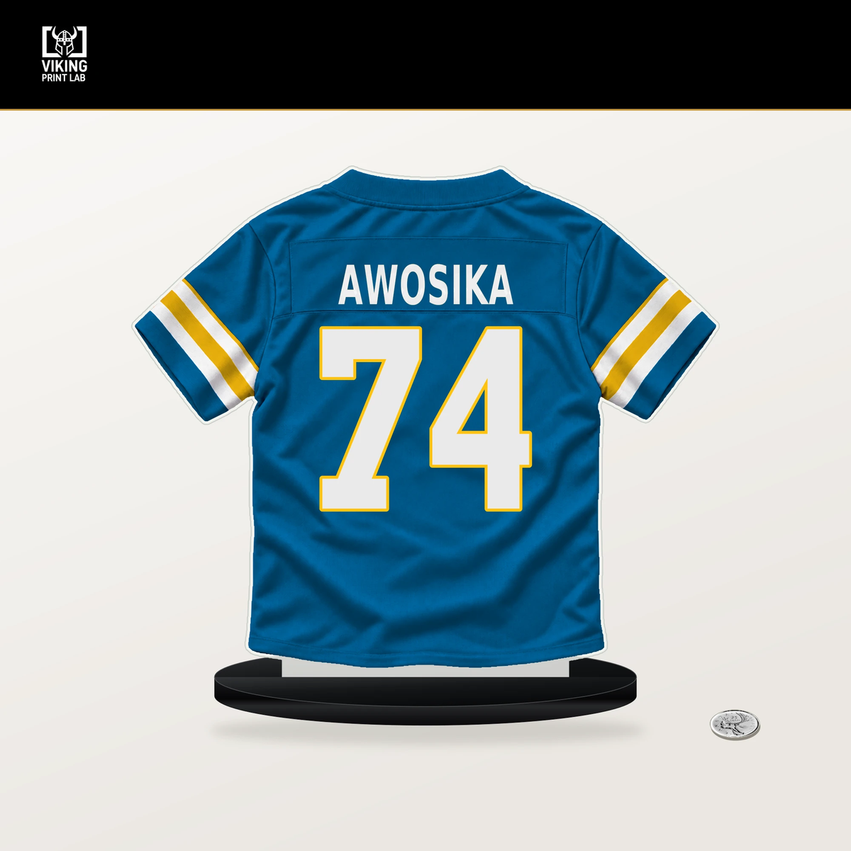 Kayode Awosika number 74 Los Angeles Chargers jersey stand with included black base.