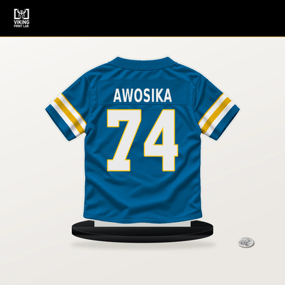 Kayode Awosika number 74 Los Angeles Chargers jersey stand with included black base.