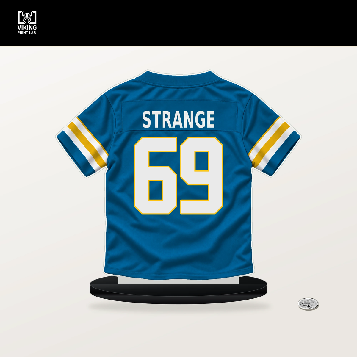 Cole Strange number 69 Los Angeles Chargers jersey stand with included black base.