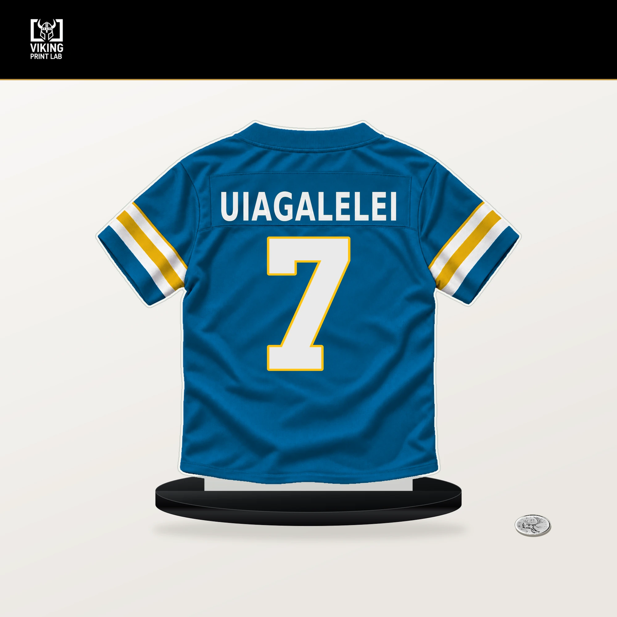 DJ Uiagalelei number 7 Los Angeles Chargers jersey stand with included black base.