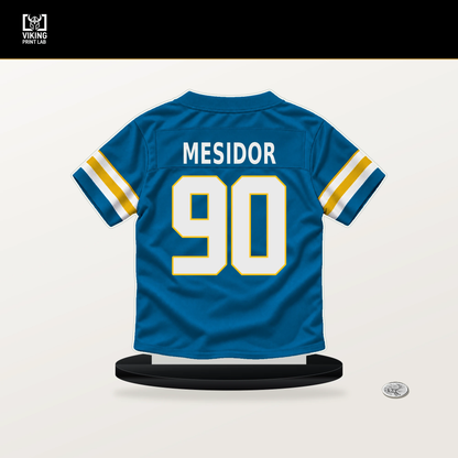 Akheem Mesidor number 90 Los Angeles Chargers jersey stand with included black base.