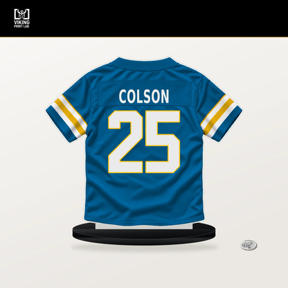 Junior Colson number 25 Los Angeles Chargers jersey stand with included black base.