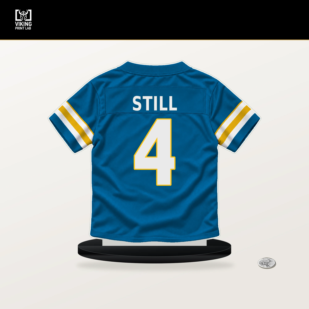 Tarheeb Still number 4 Los Angeles Chargers jersey stand with included black base.