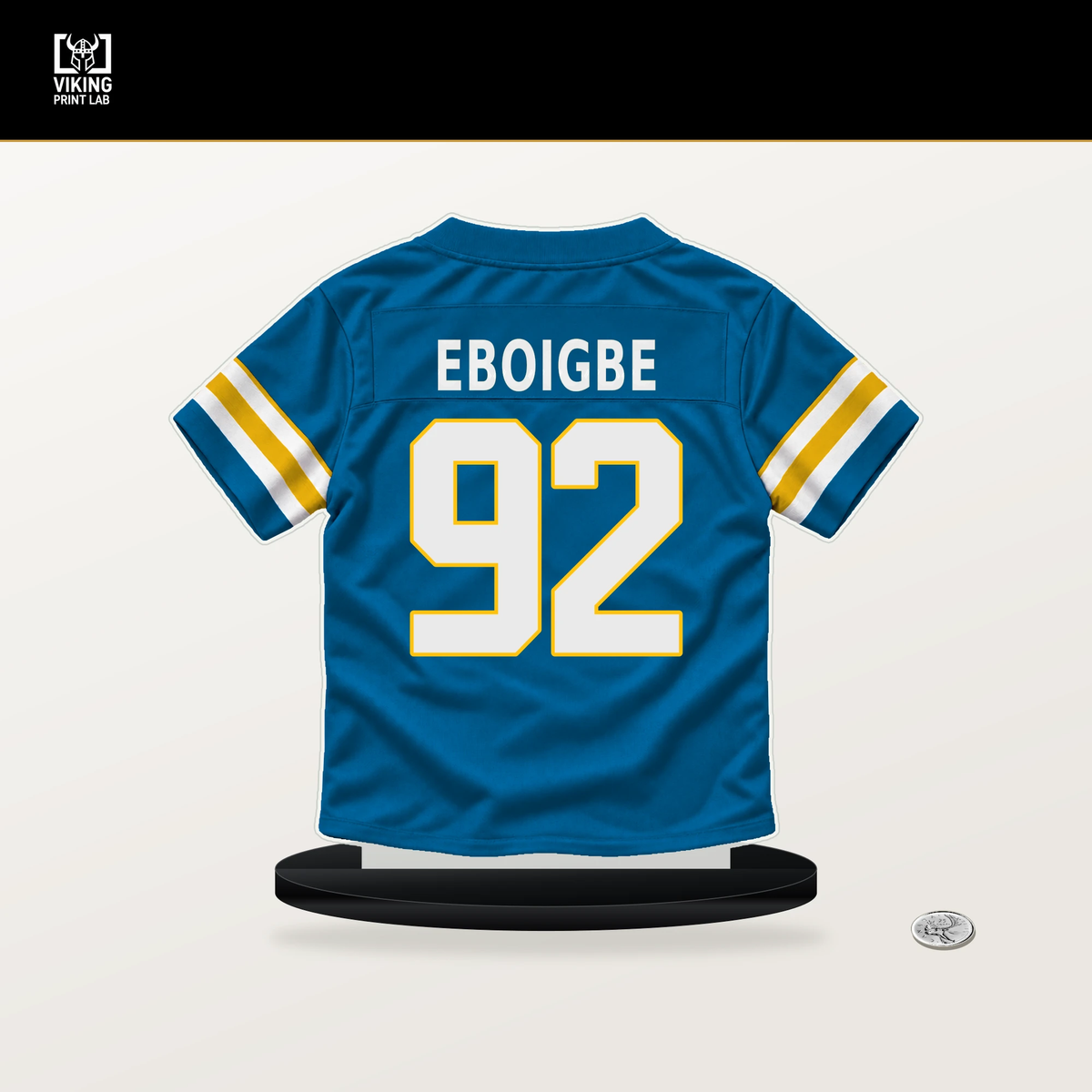 Justin Eboigbe number 92 Los Angeles Chargers jersey stand with included black base.