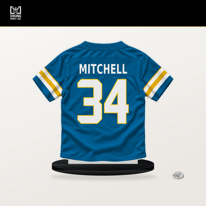 Keaton Mitchell number 34 Los Angeles Chargers jersey stand with included black base.