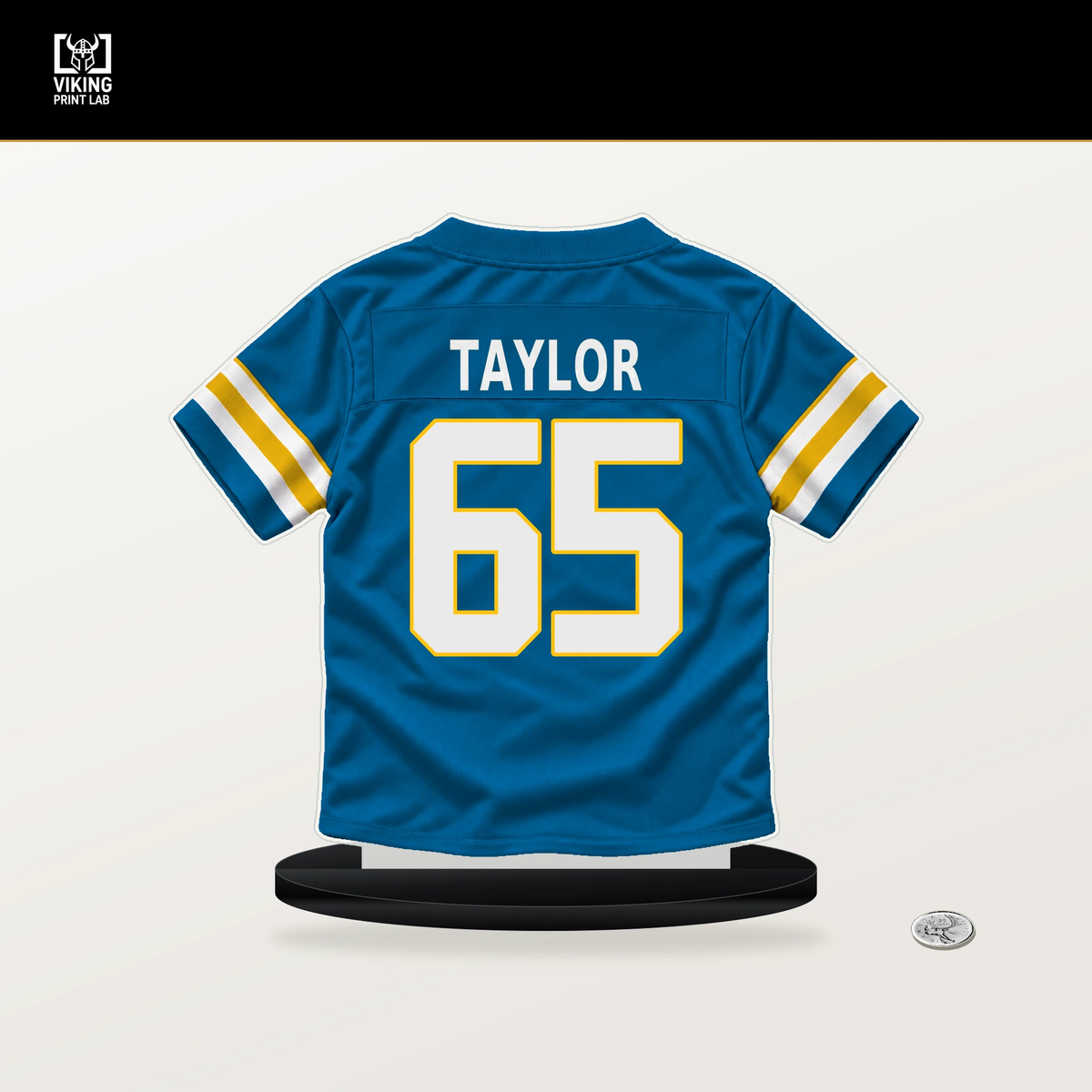 Logan Taylor number 65 Los Angeles Chargers jersey stand with included black base.