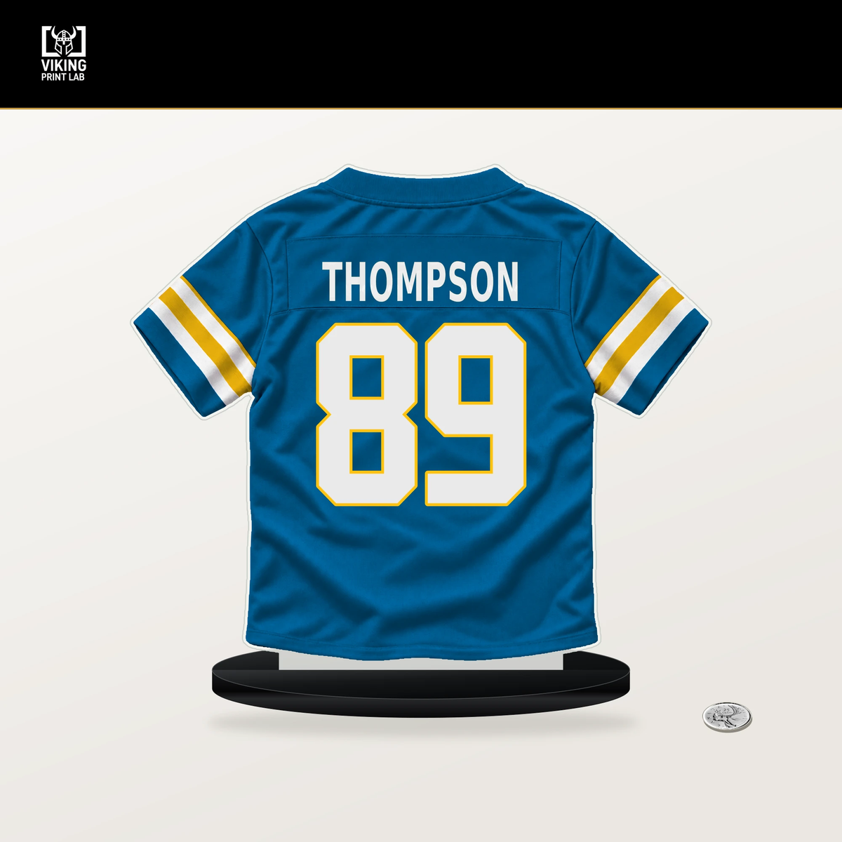 Brenen Thompson number 89 Los Angeles Chargers jersey stand with included black base.