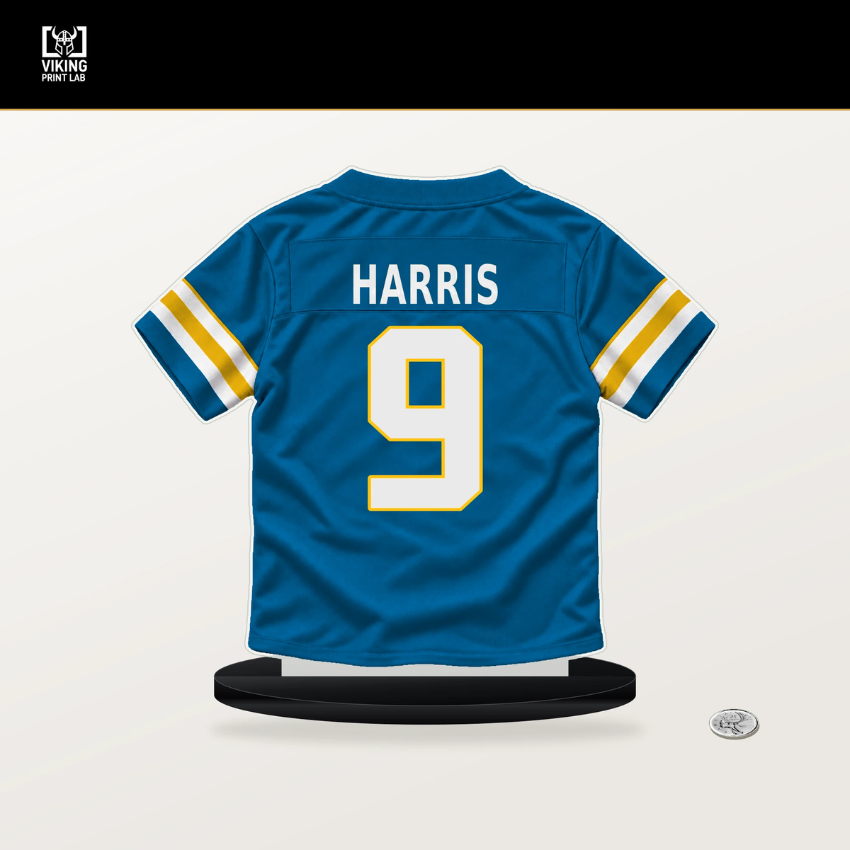 Tre' Harris number 9 Los Angeles Chargers jersey stand with included black base.