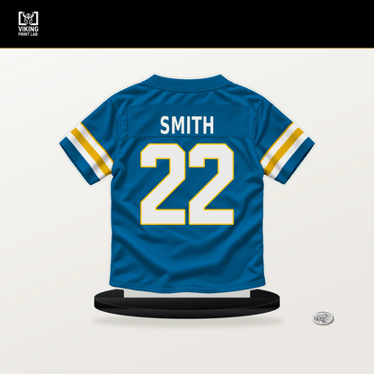 Genesis Smith number 22 Los Angeles Chargers jersey stand with included black base.