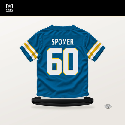 Jacob Spomer number 60 Los Angeles Chargers jersey stand with included black base.