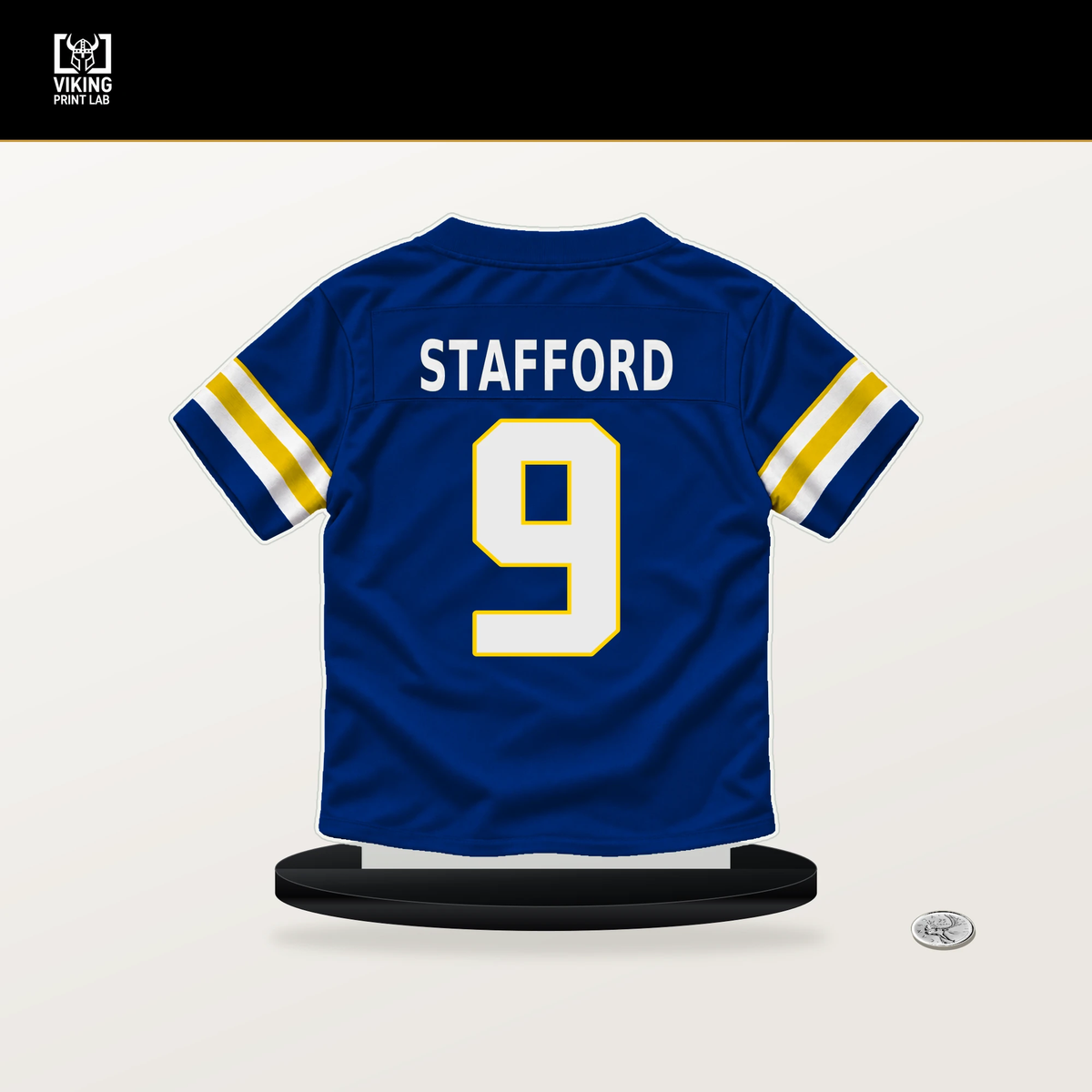 Matthew Stafford number 9 Los Angeles Rams jersey stand with included black base.