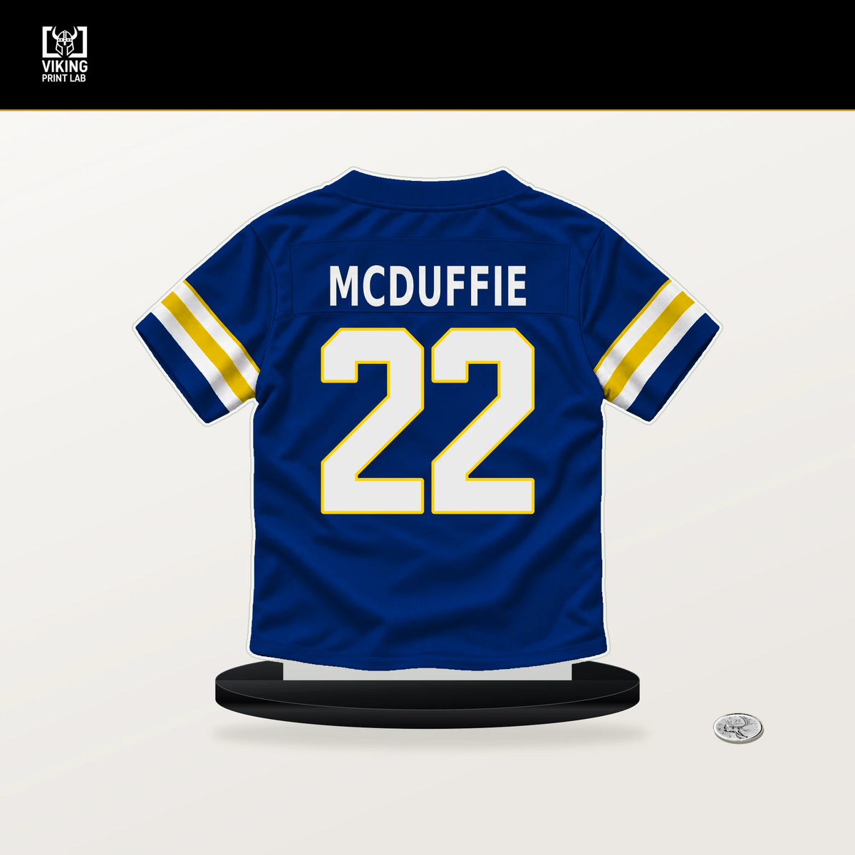 Trent McDuffie number 22 Los Angeles Rams jersey stand with included black base.