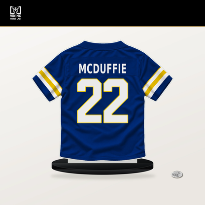 Trent McDuffie number 22 Los Angeles Rams jersey stand with included black base.
