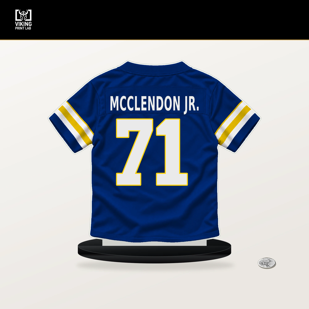 Warren McClendon Jr. number 71 Los Angeles Rams jersey stand with included black base.