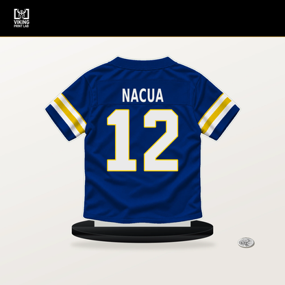 Puka Nacua number 12 Los Angeles Rams jersey stand with included black base.
