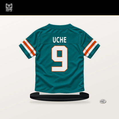 Josh Uche number 9 Miami Dolphins jersey stand with included black base.