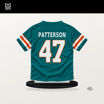 Riley Patterson number 47 Miami Dolphins jersey stand with included black base.