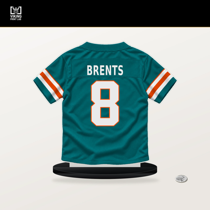 JuJu Brents number 8 Miami Dolphins jersey stand with included black base.