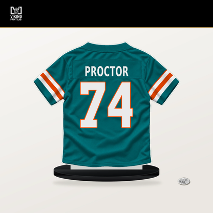 Kadyn Proctor number 74 Miami Dolphins jersey stand with included black base.