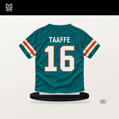 Michael Taaffe number 16 Miami Dolphins jersey stand with included black base.