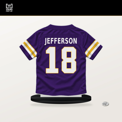 Justin Jefferson number 18 Minnesota Vikings jersey stand with included black base.
