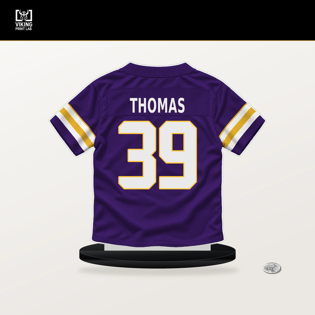 Jacob Thomas number 39 Minnesota Vikings jersey stand with included black base.
