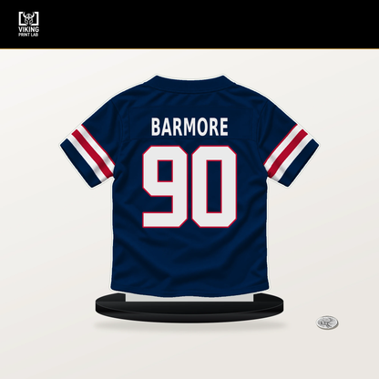 Christian Barmore number 90 New England Patriots jersey stand with included black base.