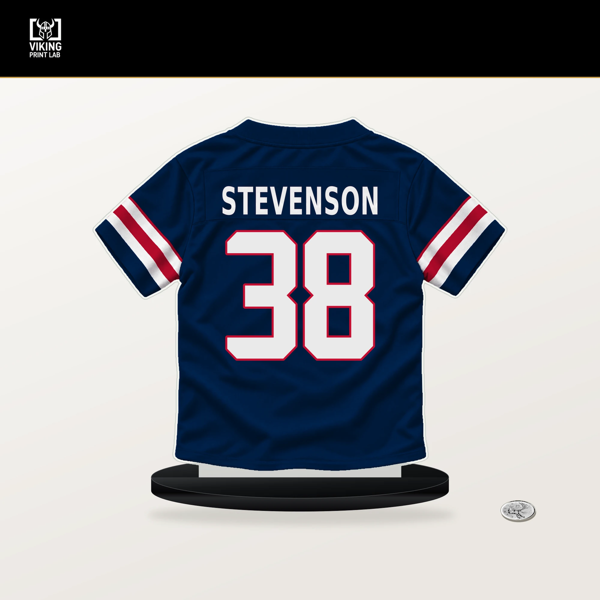 Rhamondre Stevenson number 38 New England Patriots jersey stand with included black base.