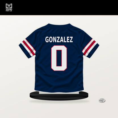 Christian Gonzalez number 0 New England Patriots jersey stand with included black base.